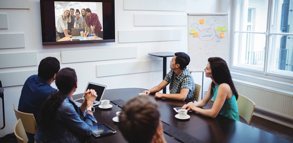 Business executives doing a video conference in the conference room